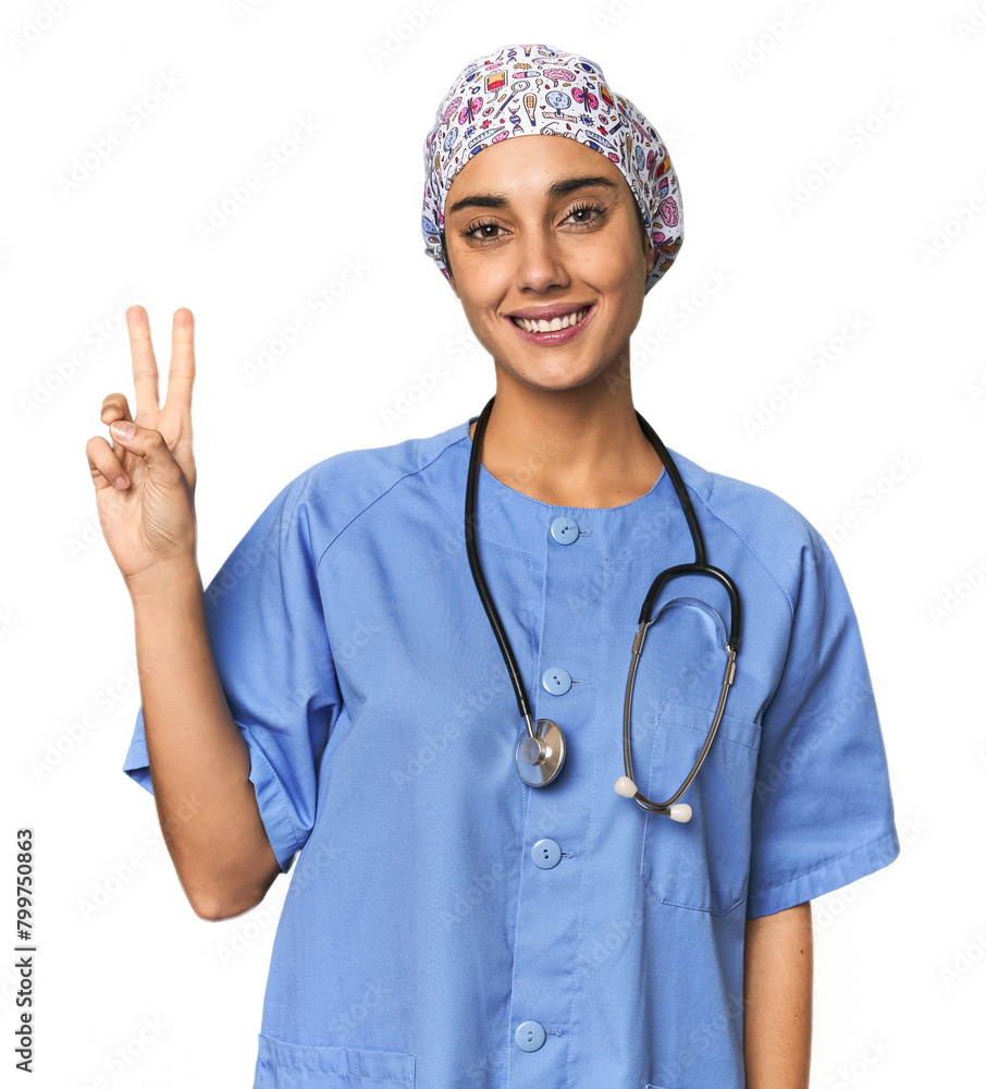 Hispanic nurse in uniform with stethoscope showing number two with fingers. Hispanic nurse in uniform with stethoscope showing number two with fingers.
