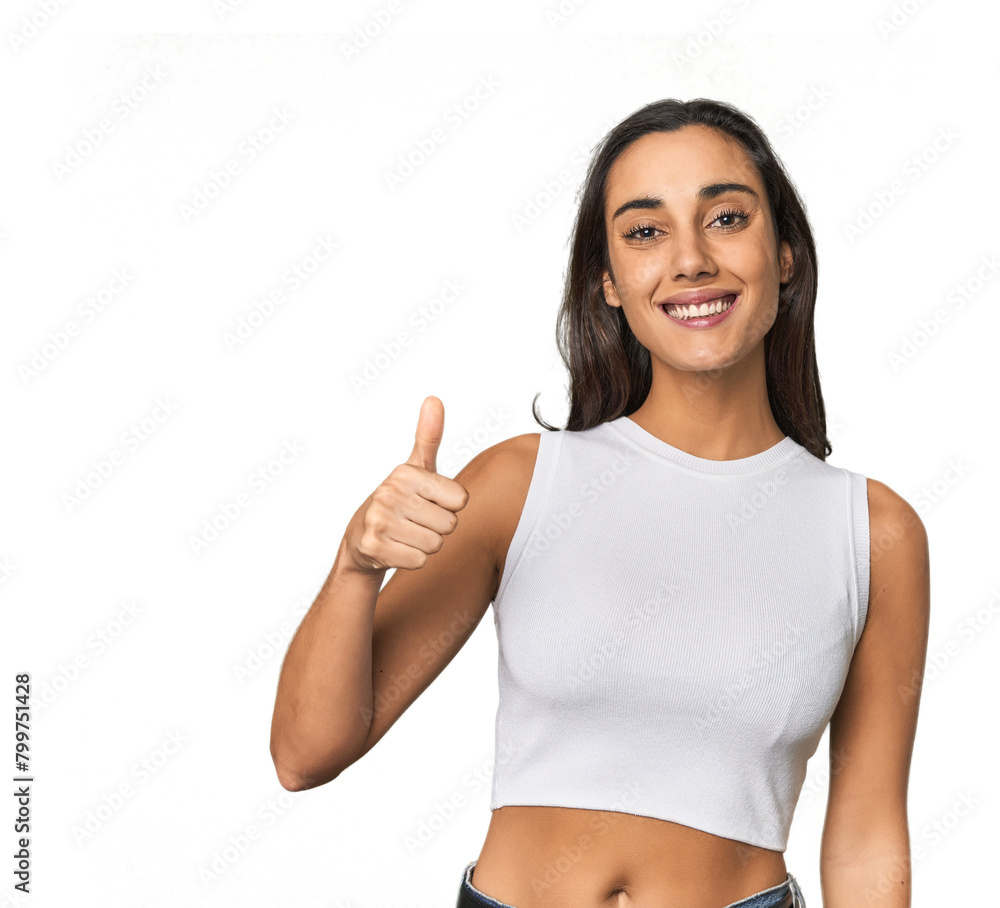 Hispanic young woman smiling and raising thumb up