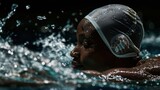 Side view of black female swimmer swimming breaststroke