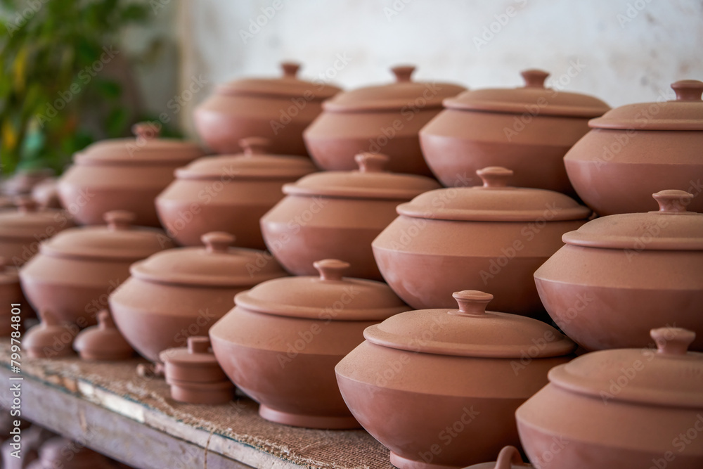 Neatly stacked clay embryos and molds in a traditional Chinese pottery factory Neatly stacked clay embryos and molds in a traditional Chinese pottery factory
