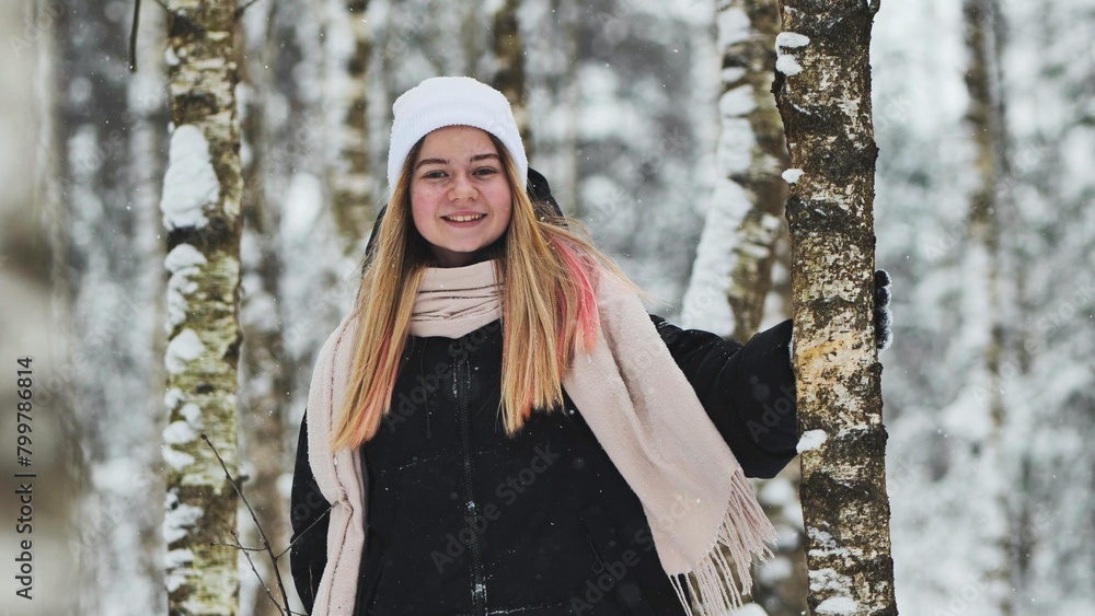 Portrait of a girl in winter in a birch forest. Portrait of a girl in winter in a birch forest.