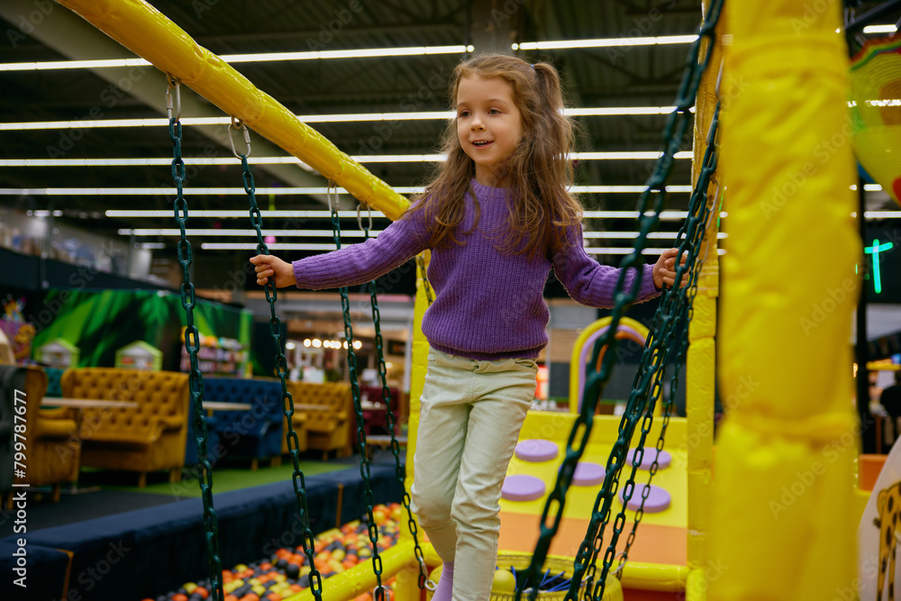 Excited girl child at indoor playground Excited girl child at indoor playground