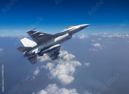 Fighter jet military aircraft flying with high speed over altocumulus cloud with blue sky 