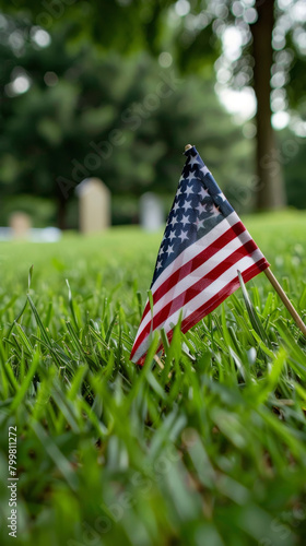 A solemn image of a soldier grave marked by a neatly placed American flag, symbolizing honor and remembrance on Memorial Day.
