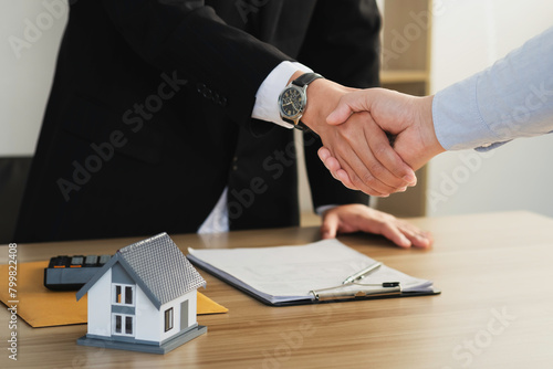 Home sales and home insurance concept. Business success, Real estate agents and customers shake hands to congratulate after signing.