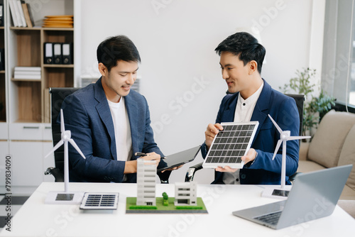 business team people planning and discussing on recycle reduce reuse policy symbol in office meeting room. Green business company and Solar Energy Environment city Concept..