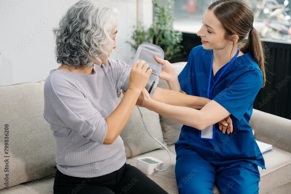 Obraz premium Female hands touching senior male hand Helping hands take care of the elderly concept in hospital