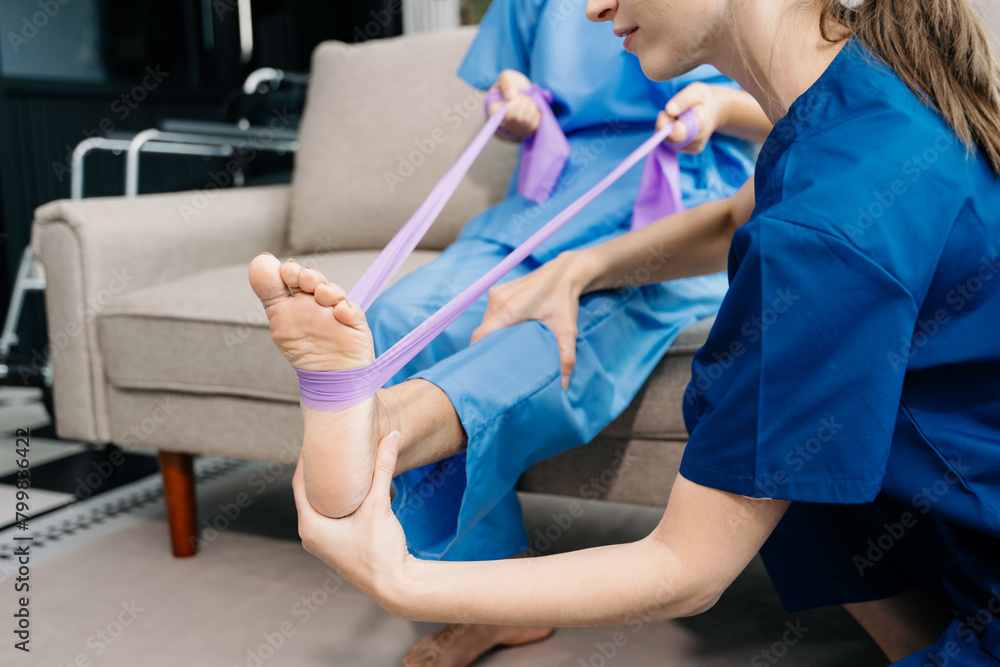 Obraz premium Physiotherapist helping elderly man patient stretching arm during exercise correct with dumbbell in hand during training hand with patient Back problems