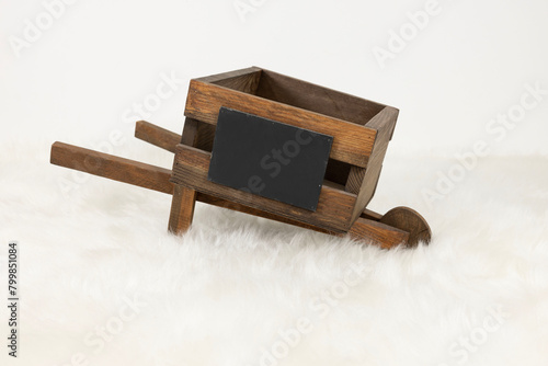 wooden wheelbarrow on white background