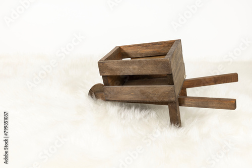 wooden wheelbarrow on white background