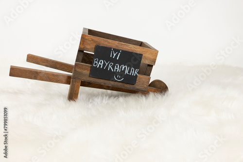 wooden wheelbarrow on white background