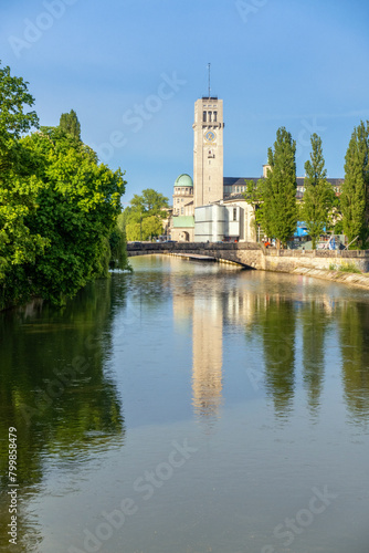 Germany, Bavaria, Munich, Arch bridge over river Isar with tower of Deutsches Museum in background photo