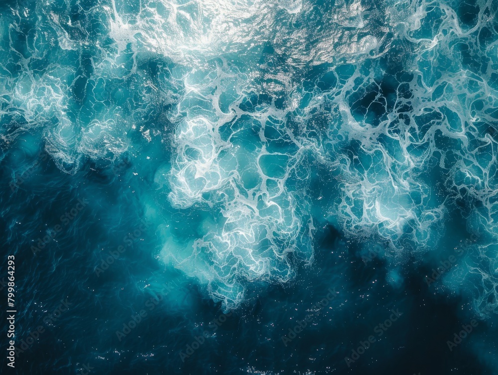 The photo shows a beautiful and clear blue ocean. The water is crystal clear and you can see the waves crashing against each other. The photo shows a beautiful and clear blue ocean. The water is crystal clear and you can see the waves crashing against each other.