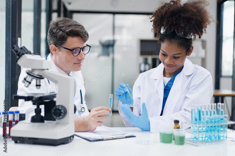 Medical science and microscope in laboratory for research concept. Two scientist with microscope Work in the lab. Medical science and microscope in laboratory for research concept. Two scientist with microscope Work in the lab.