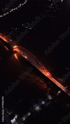 Rumpiang Bridge in the night, a bridge that stretches over the Barito river, Marabahan city, Barito Kuala district, South Kalimantan photo