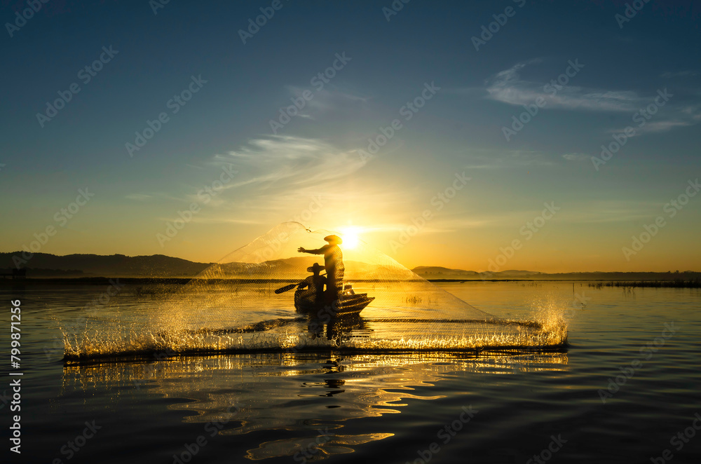 Fisherman of Bangpra Lake in action when fishing, Thailand