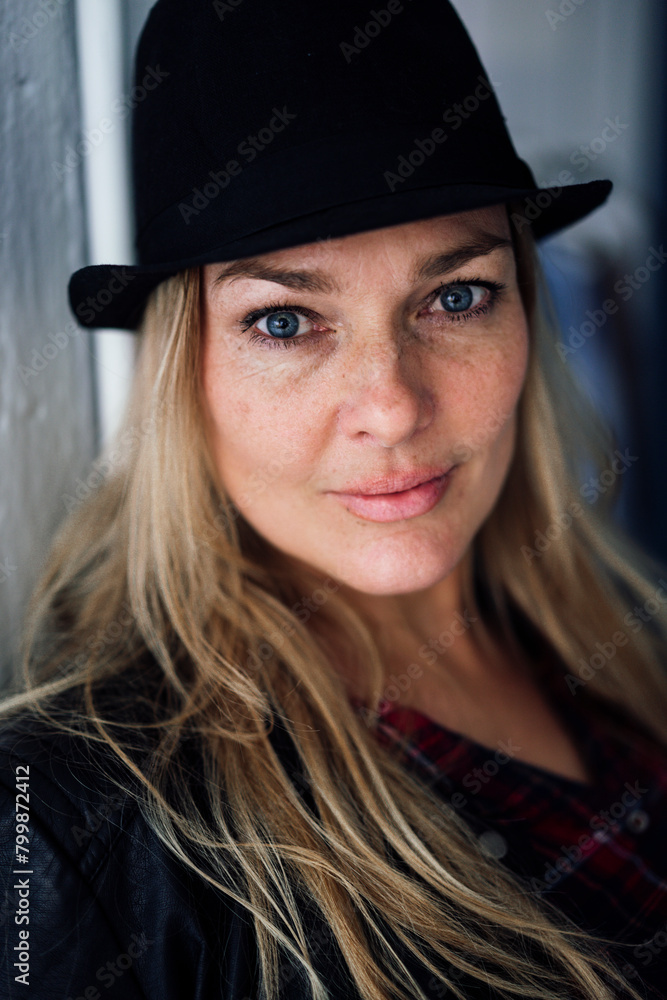 Blond mature woman wearing hat