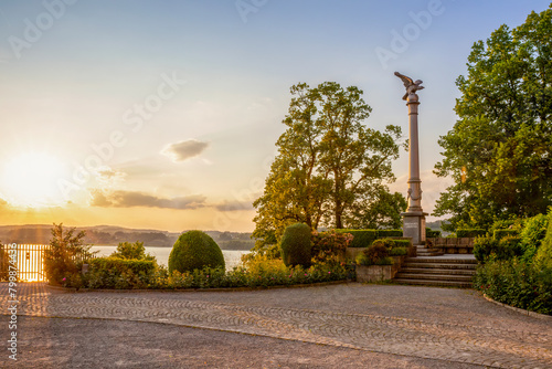 Statue on column amidst trees in park at Rapperswil, St Gallen Canton, Switzerland photo