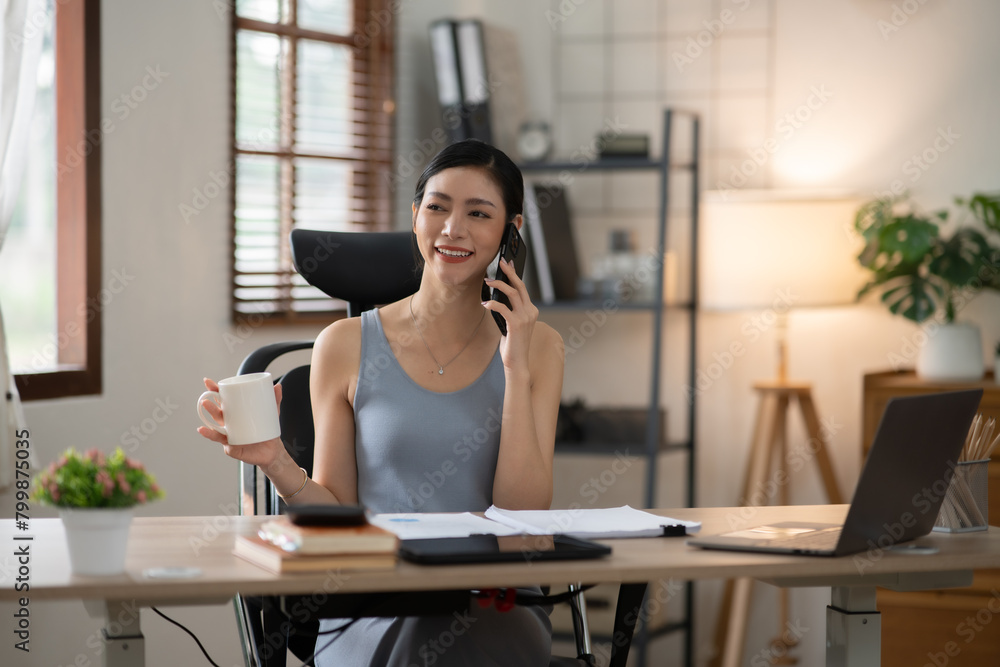 Obraz premium Asian woman doing activities, reading books, shopping online order through the internet at home or in the office during the holidays