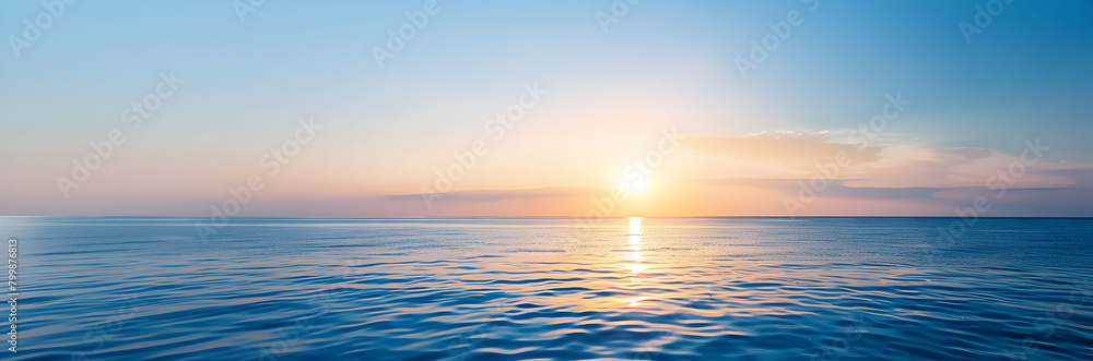 Ocean sunset web banner. Sunset over the ocean isolated on blue background with copy space.