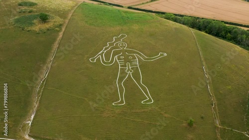 Cerne Abbas Giant chalk hill figure carving outside village of Cerne Abbas, Dorset, England. Probably dates from Mediaeval. 55m length. Video fly in photo
