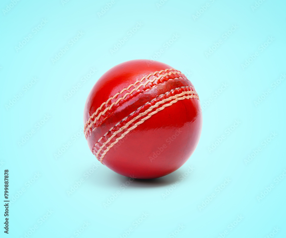 A Shiny New Test Cricket Match Ball Leather Hard Stitched Ball Closeup Photo On Blue Background A Shiny New Test Cricket Match Ball Leather Hard Stitched Ball Closeup Photo On Blue Background
