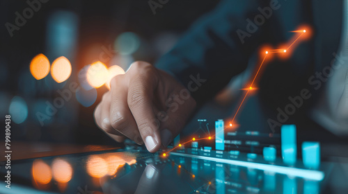 Businessman hand using tablet with creative glowing arrow and stock chart, Hand of businessman use tablet analysis stock market graph growth and increase of chart positive indicators