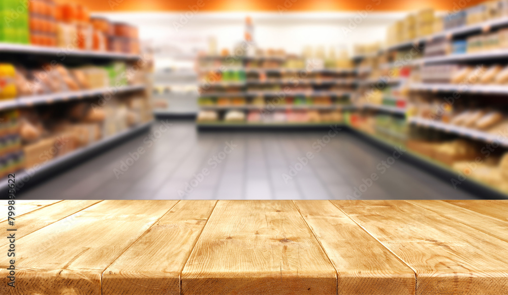 Empty wood table top with supermarket blurred background for product display