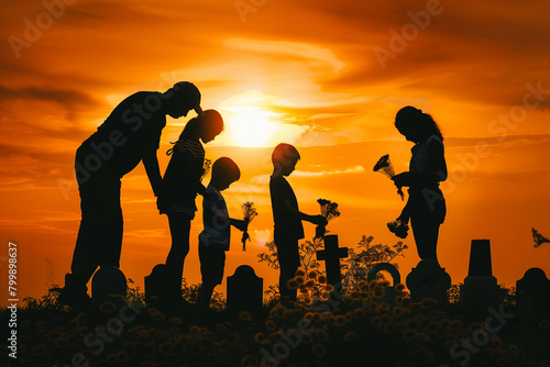 Family Paying Respect to Fallen Soldiers at Sunset on Memorial Day
