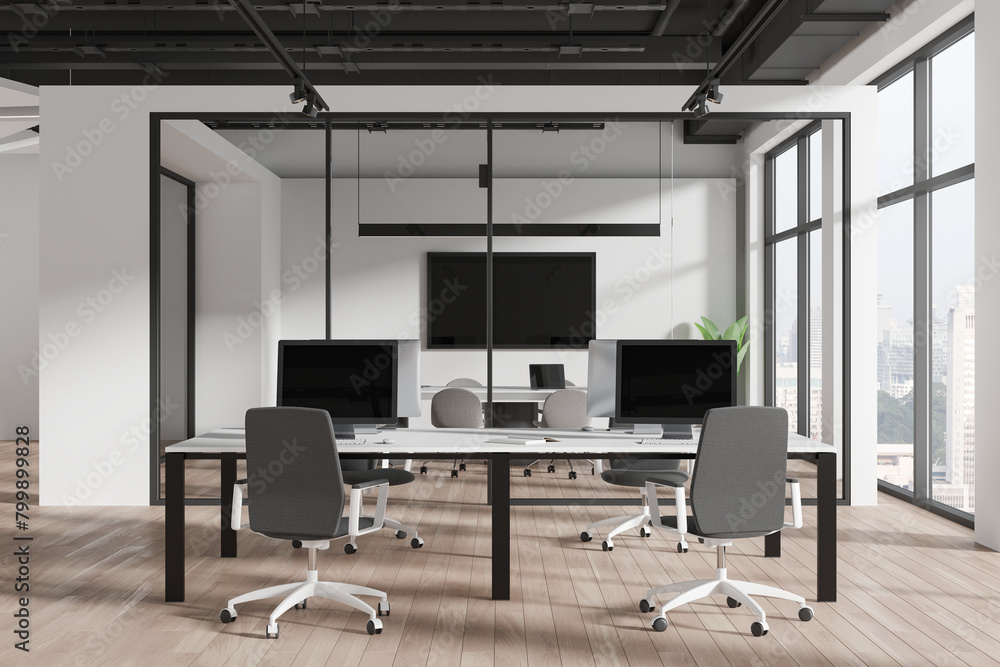 Modern workspace interior with armchairs and pc monitors, panoramic window Modern workspace interior with armchairs and pc monitors, panoramic window
