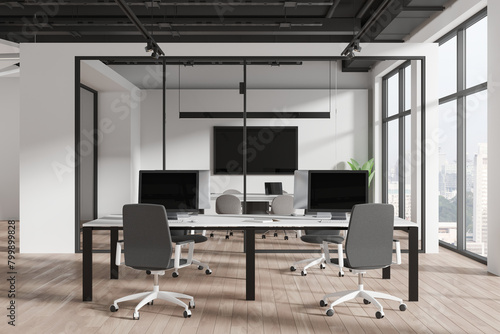 Modern workspace interior with armchairs and pc monitors  panoramic window
