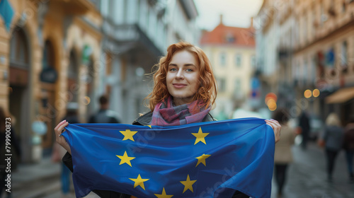 Woman holds the European Union flag in her hand. EU flag at a demonstration for EU accession