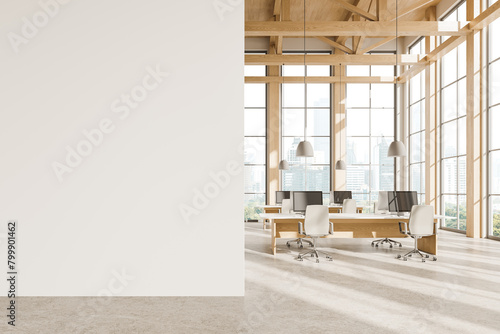 Wooden coworking interior with pc computers on desks in row, window. Mockup wall photo