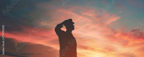 Reflective Soldier Saluting in the Warm Glow of Sunset on Memorial Day