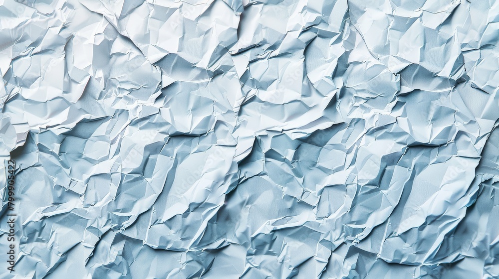 A sea of crumpled blue paper textures A sea of crumpled blue paper textures