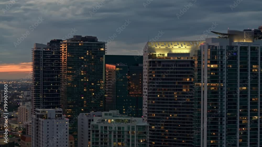 Establishing aerial view of Miami Brickell downtown skyline illuminated. Aerial close up view of Miami modern skyscraper, hotels and residential buildings on a beautiful sunset. Miami Florida in 4K Establishing aerial view of Miami Brickell downtown skyline illuminated. Aerial close up view of Miami modern skyscraper, hotels and residential buildings on a beautiful sunset. Miami Florida in 4K