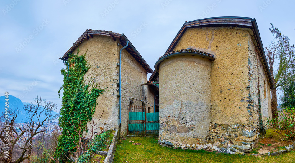 The old shabby medieval San Maurizio Church in Lugano, Switzerland The old shabby medieval San Maurizio Church in Lugano, Switzerland