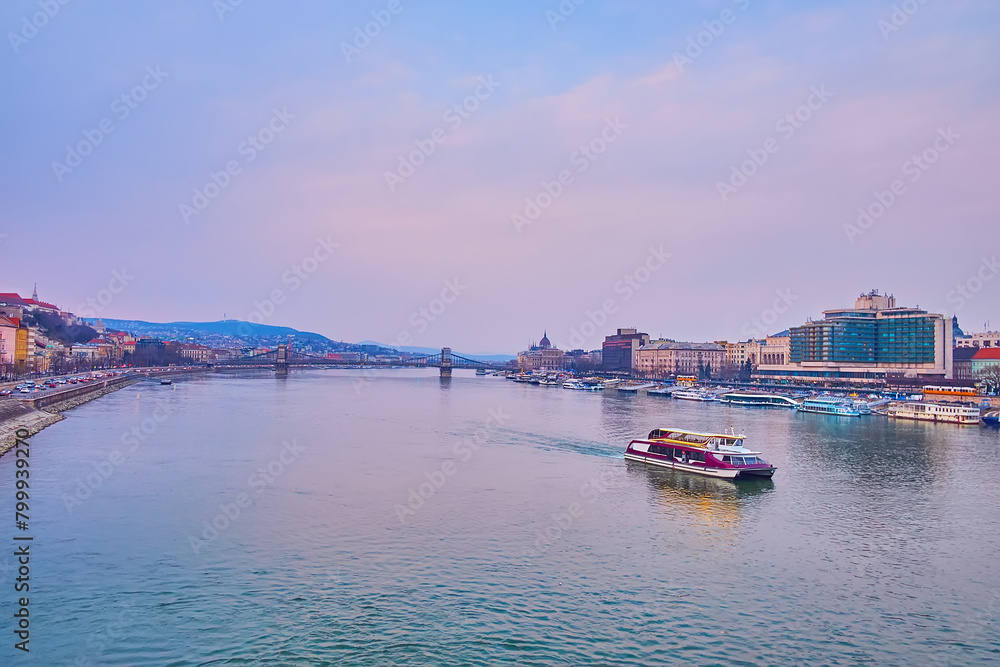 Fototapeta premium The tourist ferry on Danube against the Szechenyi Chain Bridge, Budapest, Hungary
