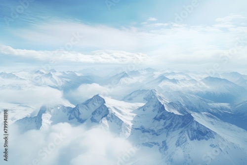 Majestic snow-capped mountain peaks in the clouds