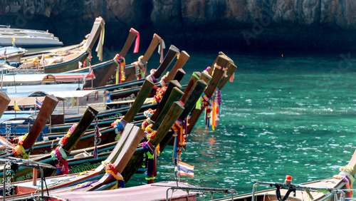 National Thai boats on a sandy beach in Thailand photo