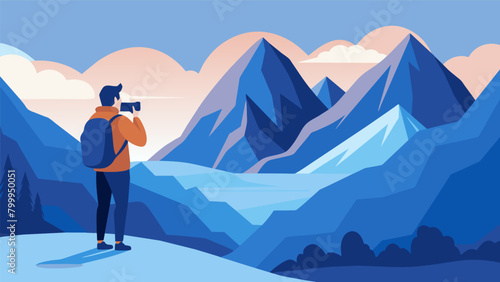 A man standing in front of a stunning mountain range capturing the rugged peaks and valleys while also taking a moment to appreciate the grandeur of.