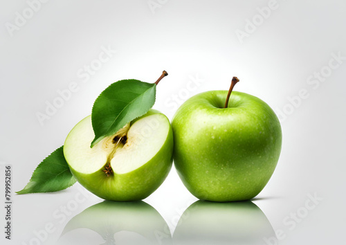 Green apple fruit with green apple half and leaf isolated on white background