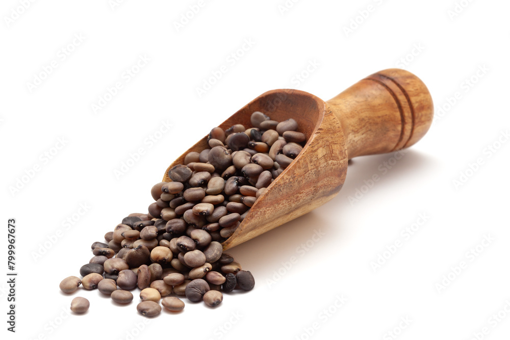 Front view of a wooden scoop filled with dry Organic cluster bean (Cyamopsis tetragonoloba) seeds. Isolated on a white background. Front view of a wooden scoop filled with dry Organic cluster bean (Cyamopsis tetragonoloba) seeds. Isolated on a white background.