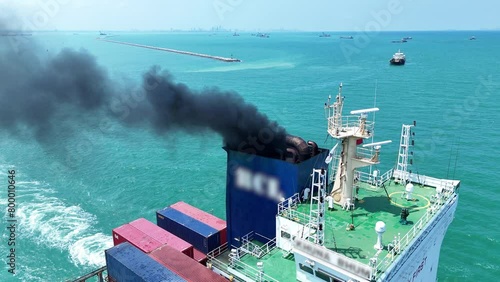 Smoke exhaust gas emissions carbondioxide from cargo lagre ship container ship,Marine diesel engine exhaust gas from combustion, Gas Emission Air Pollution from transportation. green house effect Eco photo