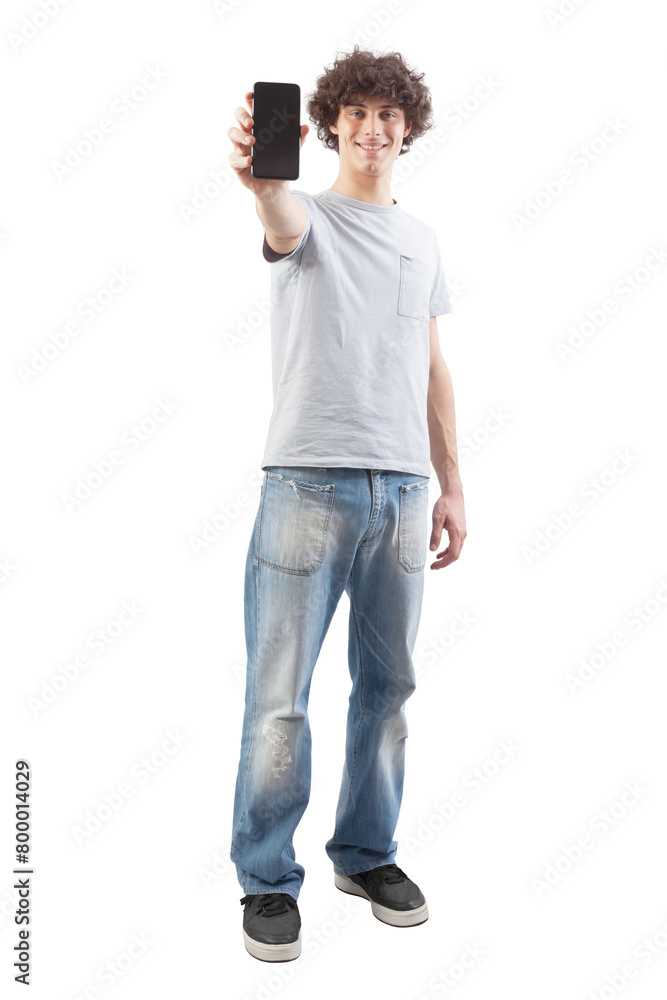 Smiling and handsome, the young man showing the blank screen of his smartphone to the camera, while looking into the camera with his blue eyes, full body isolated against a white background Smiling and handsome, the young man showing the blank screen of his smartphone to the camera, while looking into the camera with his blue eyes, full body isolated against a white background