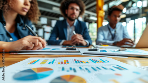 Focused business professionals engaged in a strategic meeting in a modern office