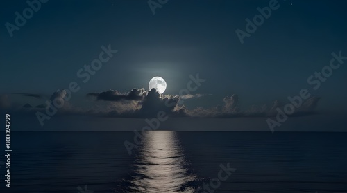 This large full blue moon rises brightly over the cloud bank in this calm ocean, moonlight over the sea.generative.ai  photo