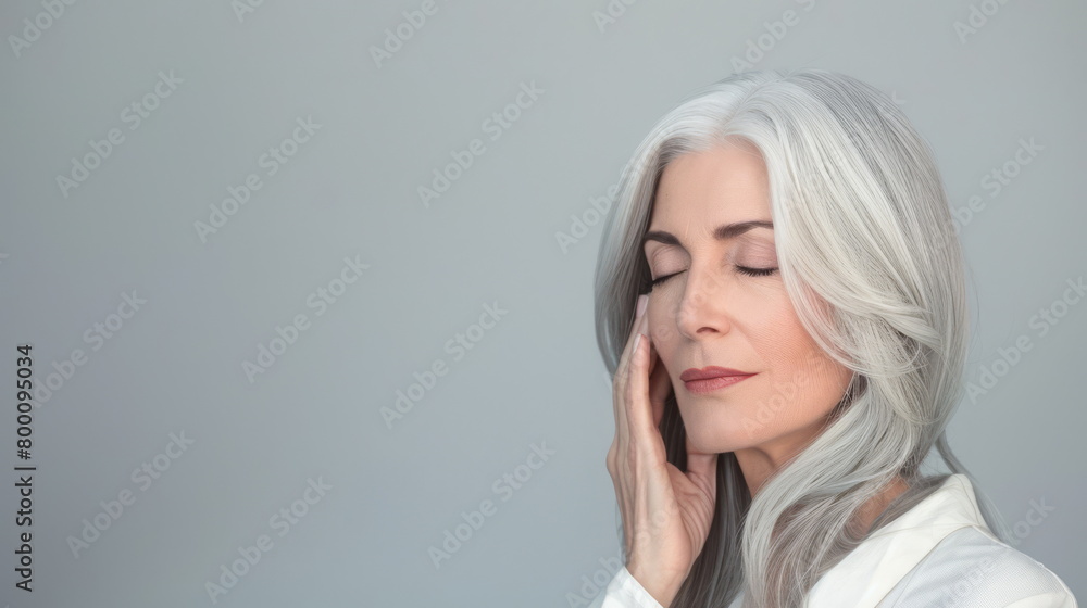 Silver-haired woman in casual attire, deep in thought. Fits introspection, modern maturity. Silver-haired woman in casual attire, deep in thought. Fits introspection, modern maturity.