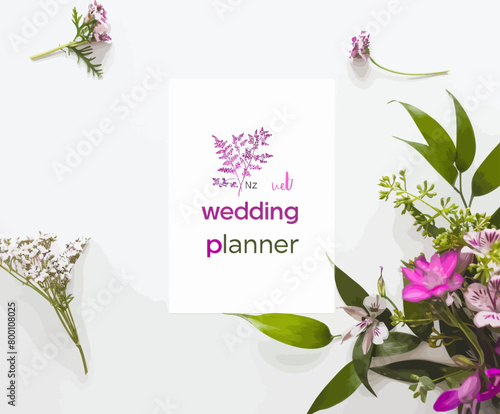 a wedding planner card surrounded by flowers