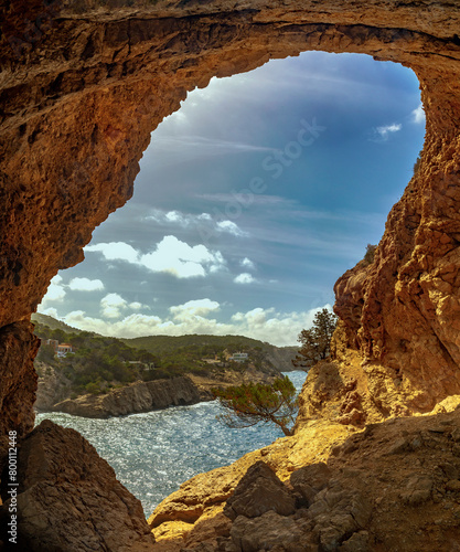 View of Cap Gross cape from a cave in the cliff, Sant Antoni de Portmany, Ibiza, Balearic Islands, Spain
